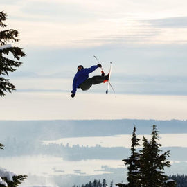 locked in skier hitting jump