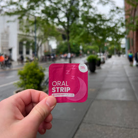 locked in sleep supplement holding in hand outside