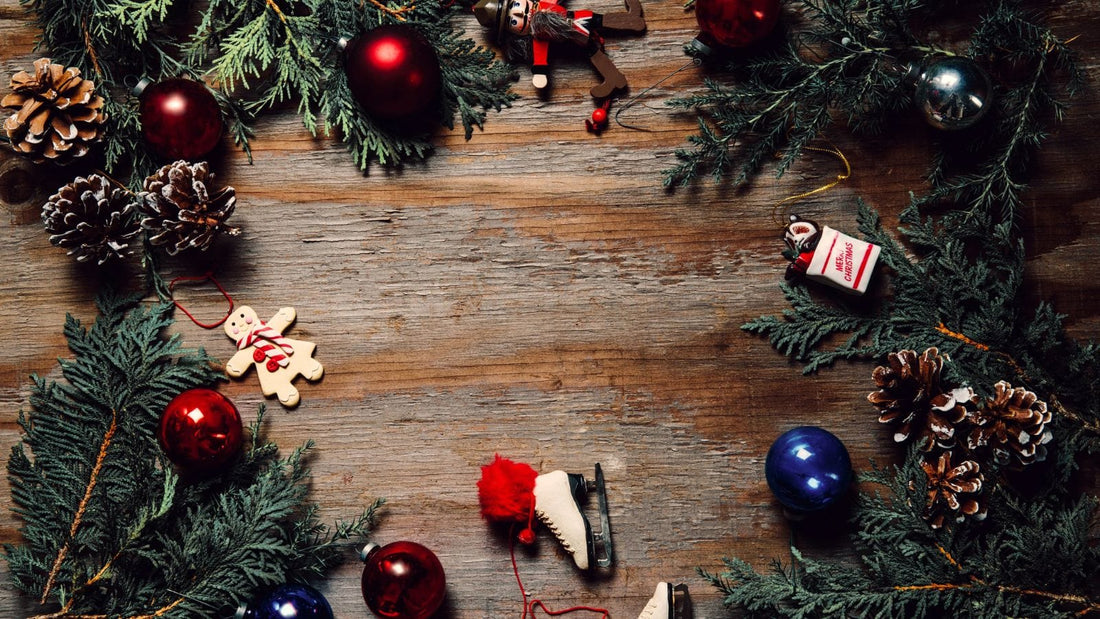 wooden surface with holiday themed decorations and tree branches