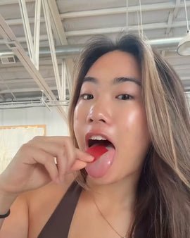 female using a locked in energy strip by placing it on her tongue