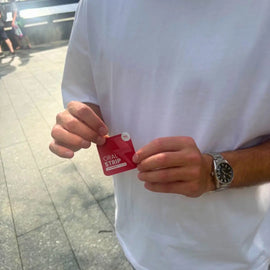 locked in energy strip being held in a mans hand outside 